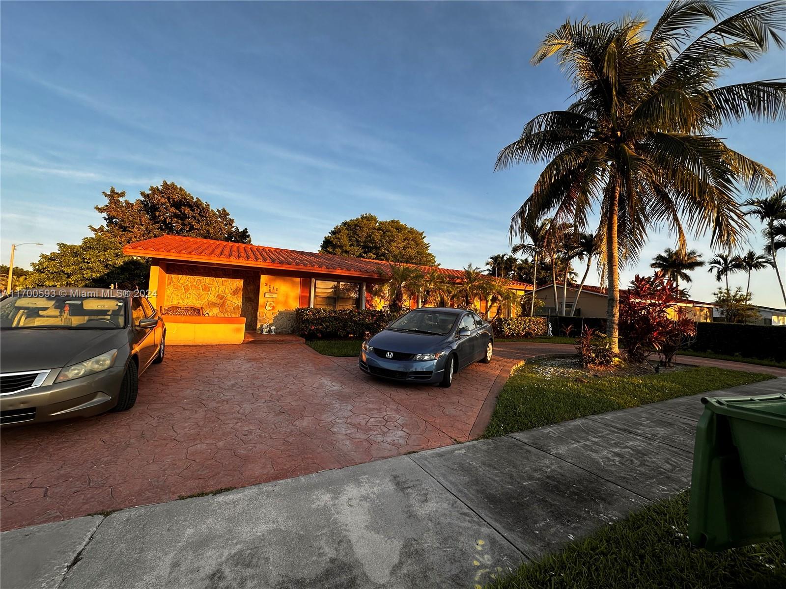 a view of a backyard with a car parked