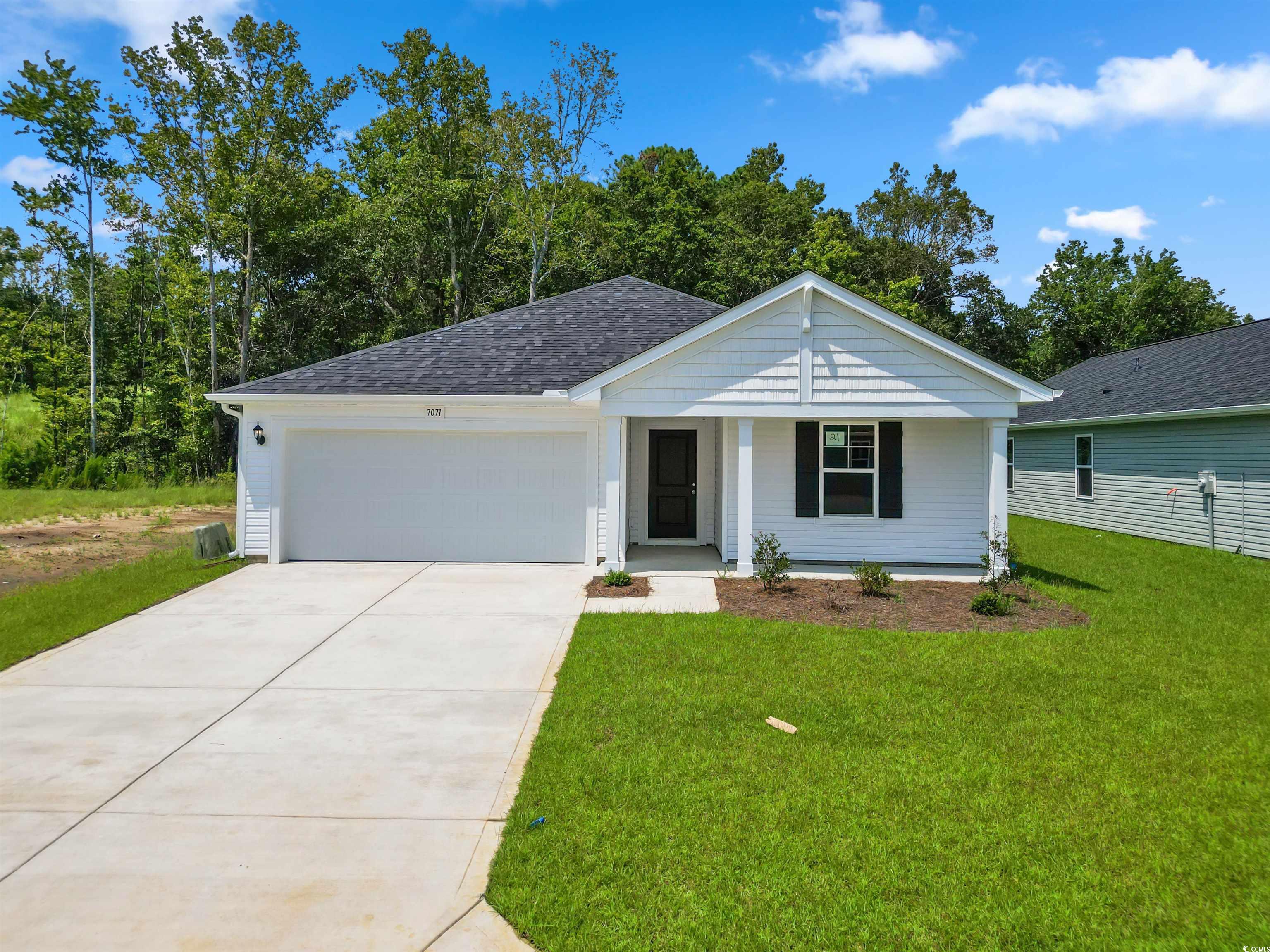 Ranch-style house featuring a garage and a front l