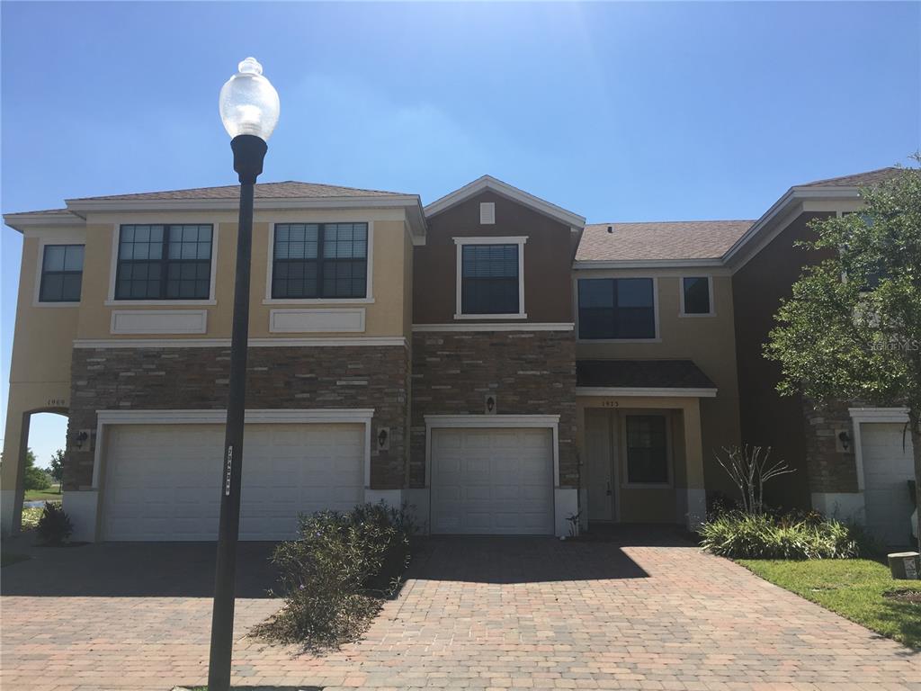 a front view of a house with yard