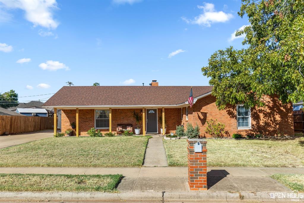 a front view of house with a yard