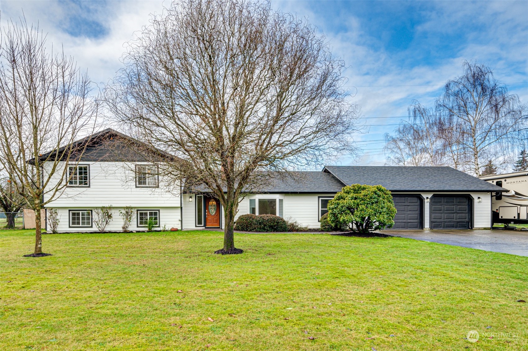 a front view of a house with a yard