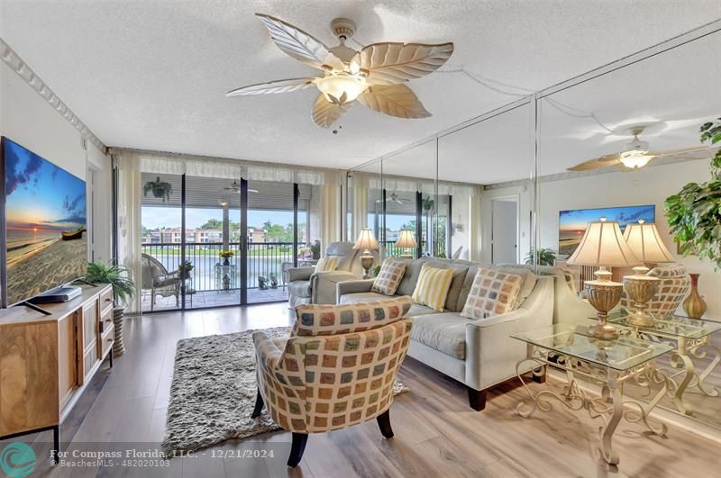 Welcome HOME to this sensational 2/2 with a wide-open floorplan and WIDE LAKE VIEWS!