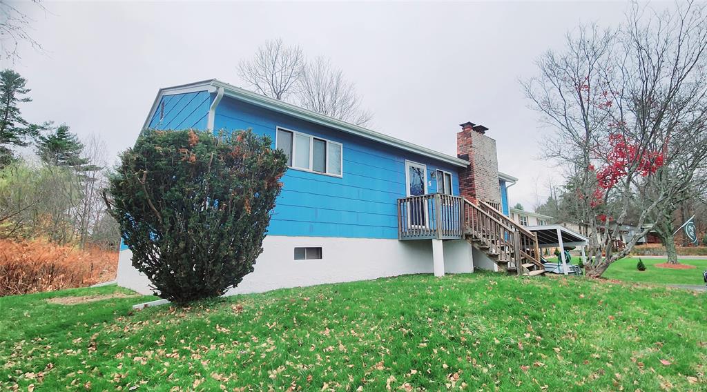 View of homes exterior featuring a lawn