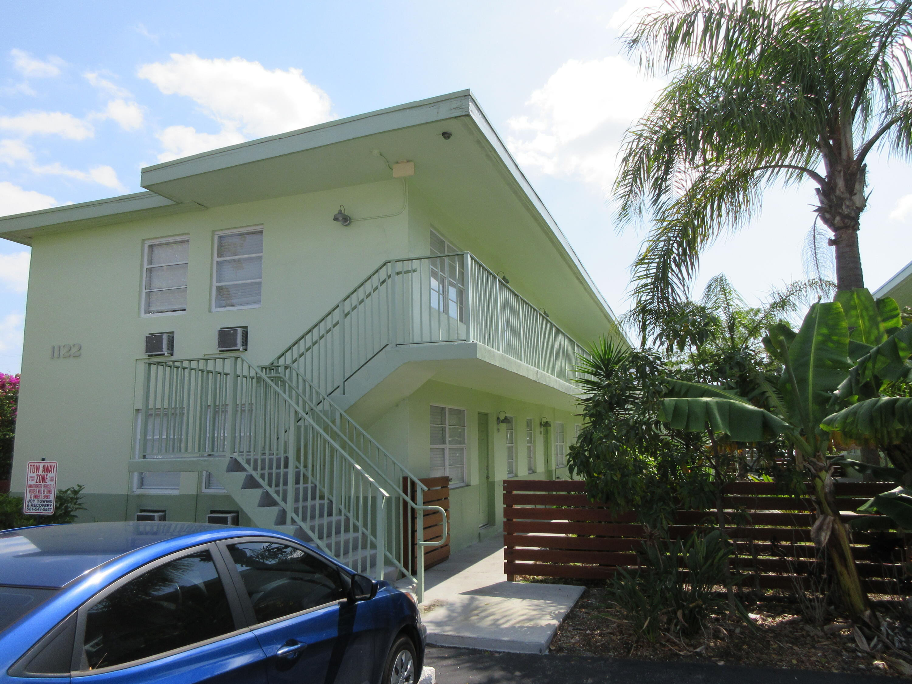 a front view of a house with parking space