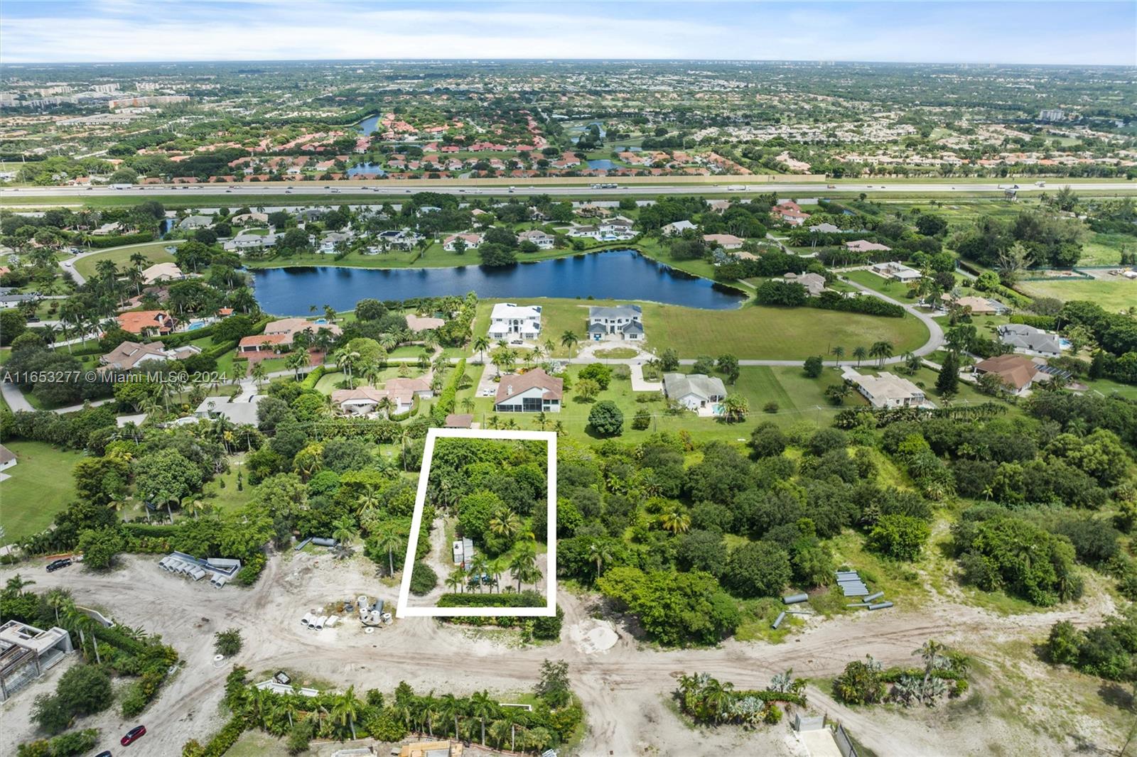 an aerial view of ocean with residential house with outdoor space