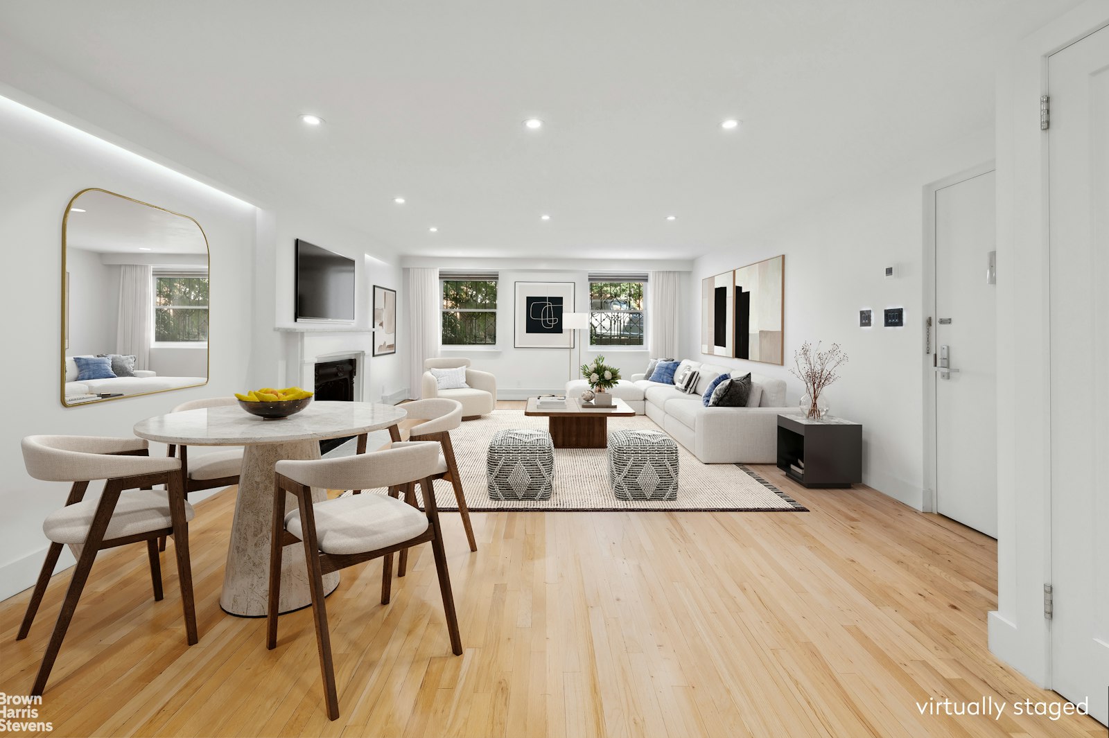 a living room with furniture wooden floor and a window