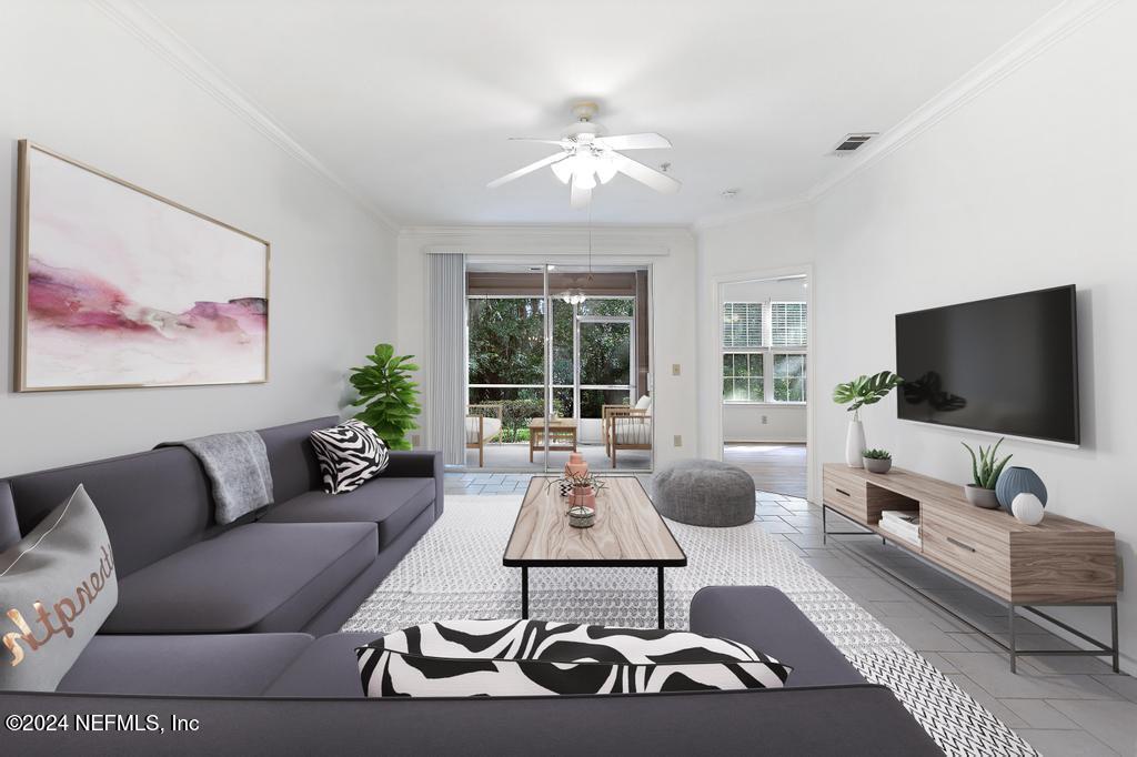 a living room with furniture and a flat screen tv