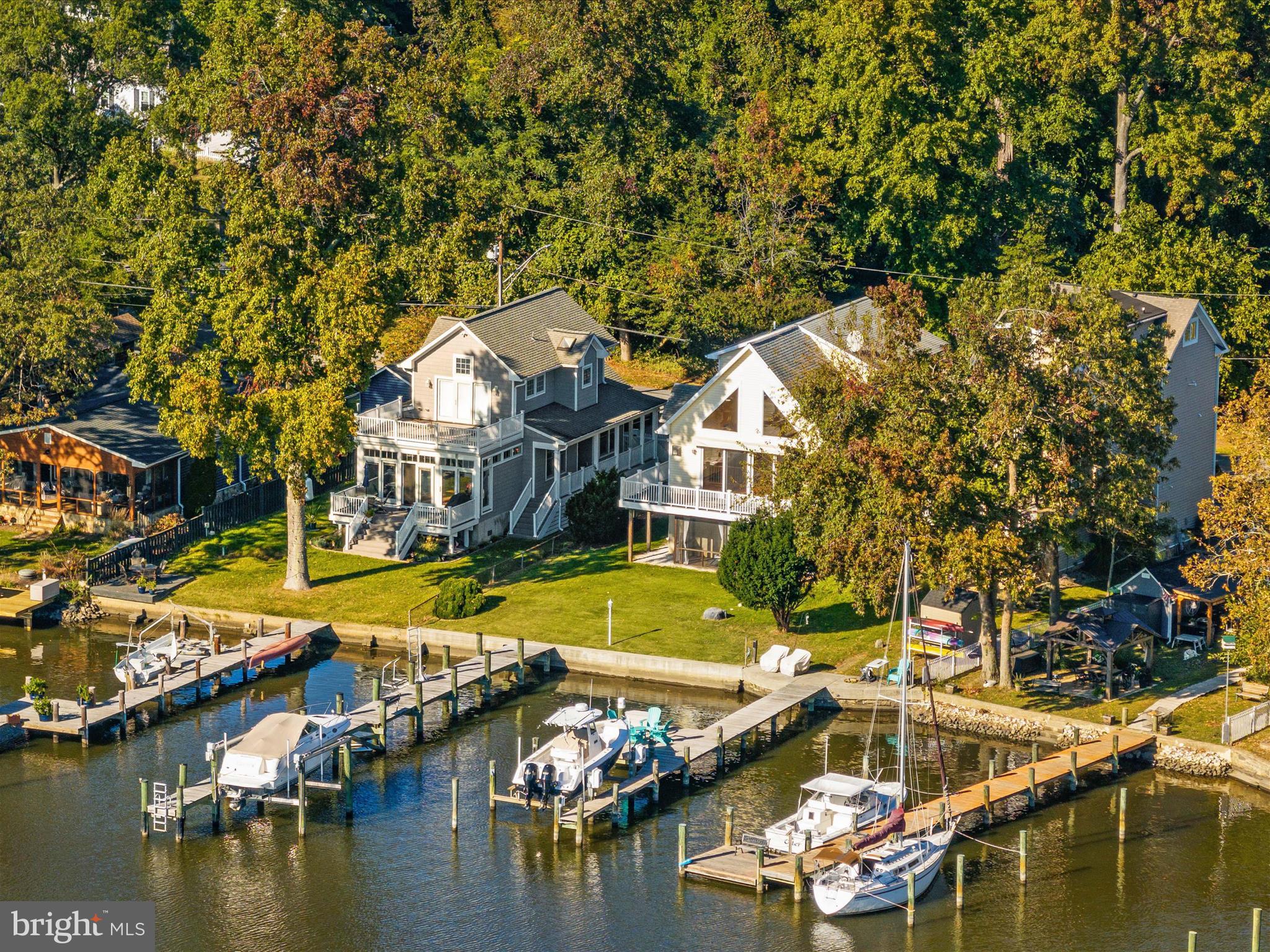 an aerial view of a house with a swimming pool and outdoor space