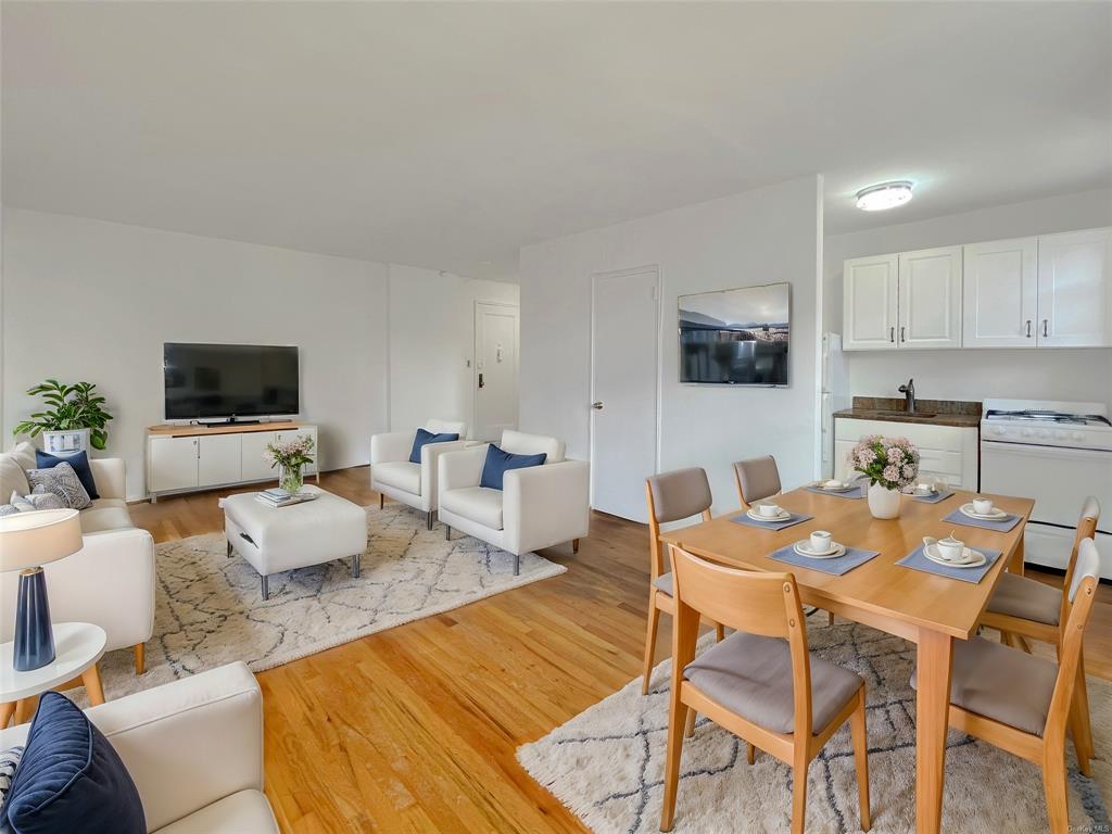 Dining room with light hardwood / wood-style flooring and sink