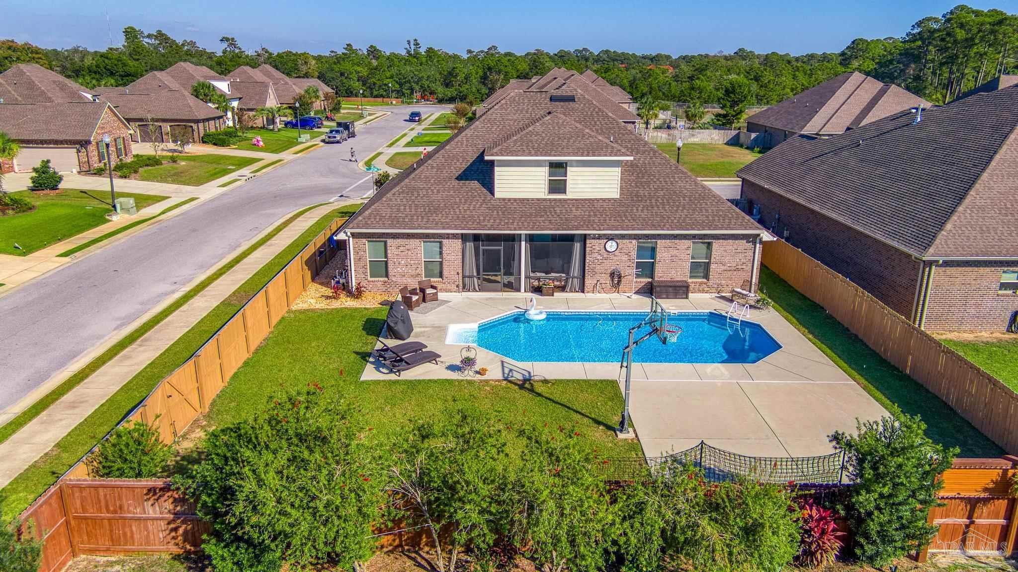 an aerial view of a house with swimming pool