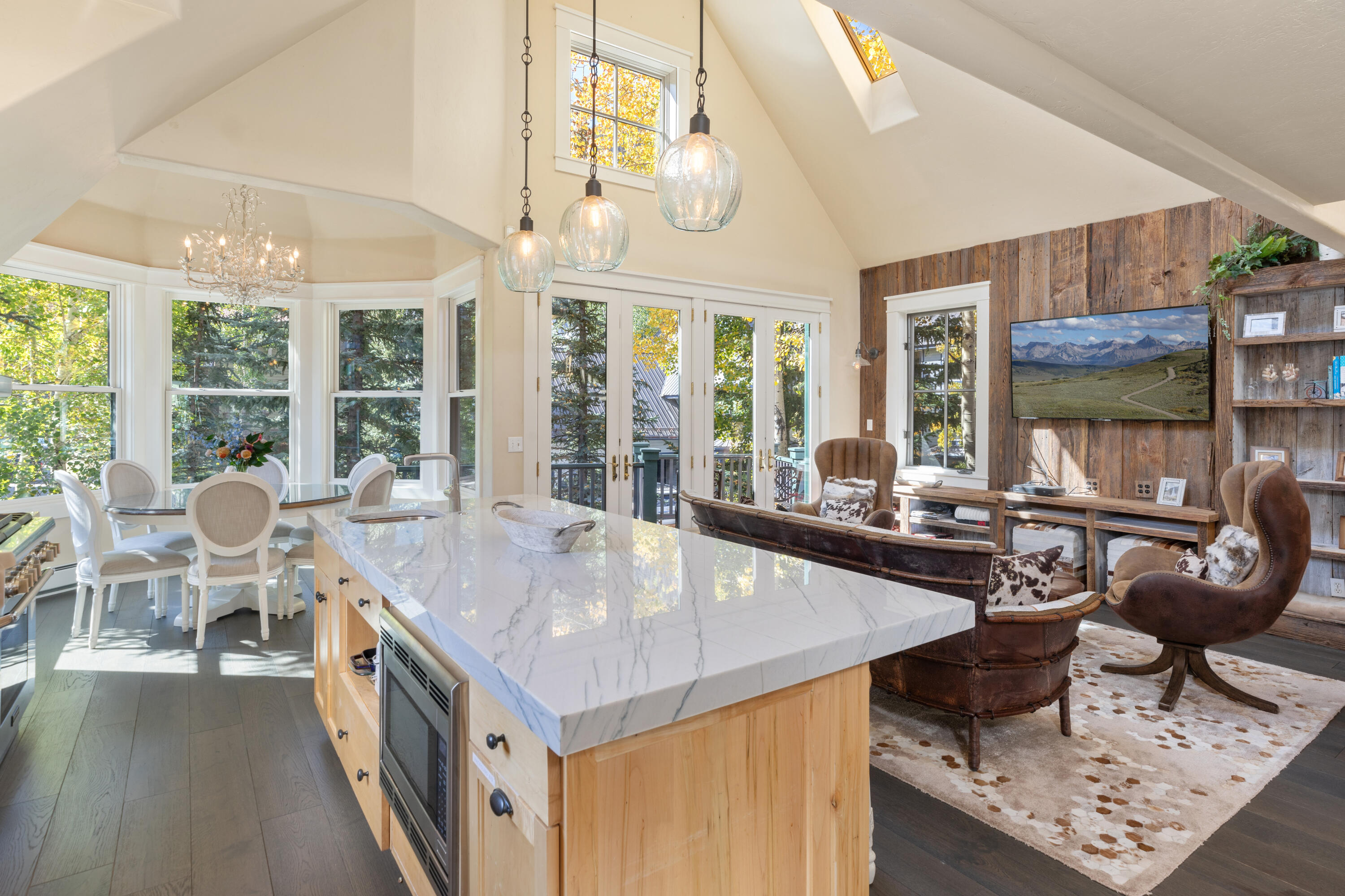 a very nice looking dining room with a large window and breakfast area