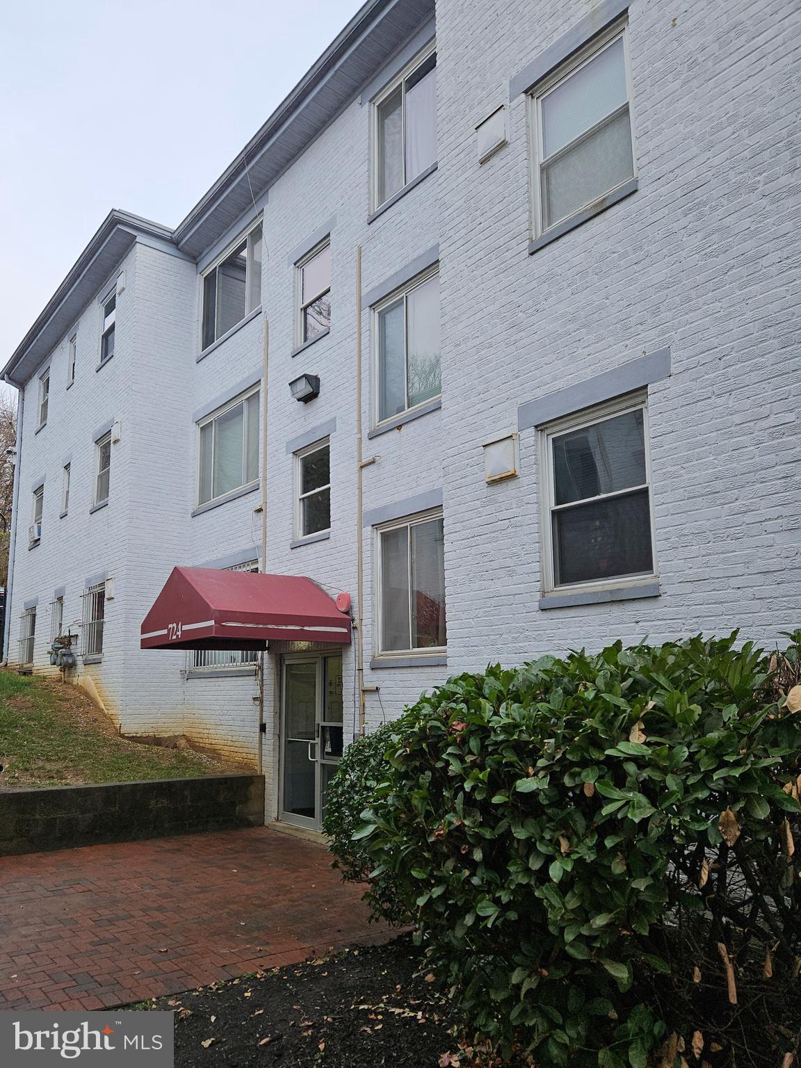 a view of a brick building with many windows