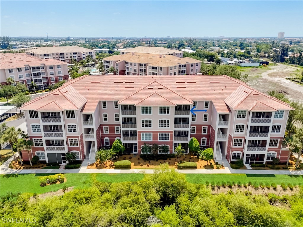 an aerial view of multiple houses with yard