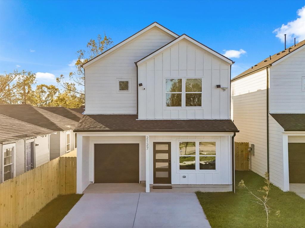 a front view of a house with a garage