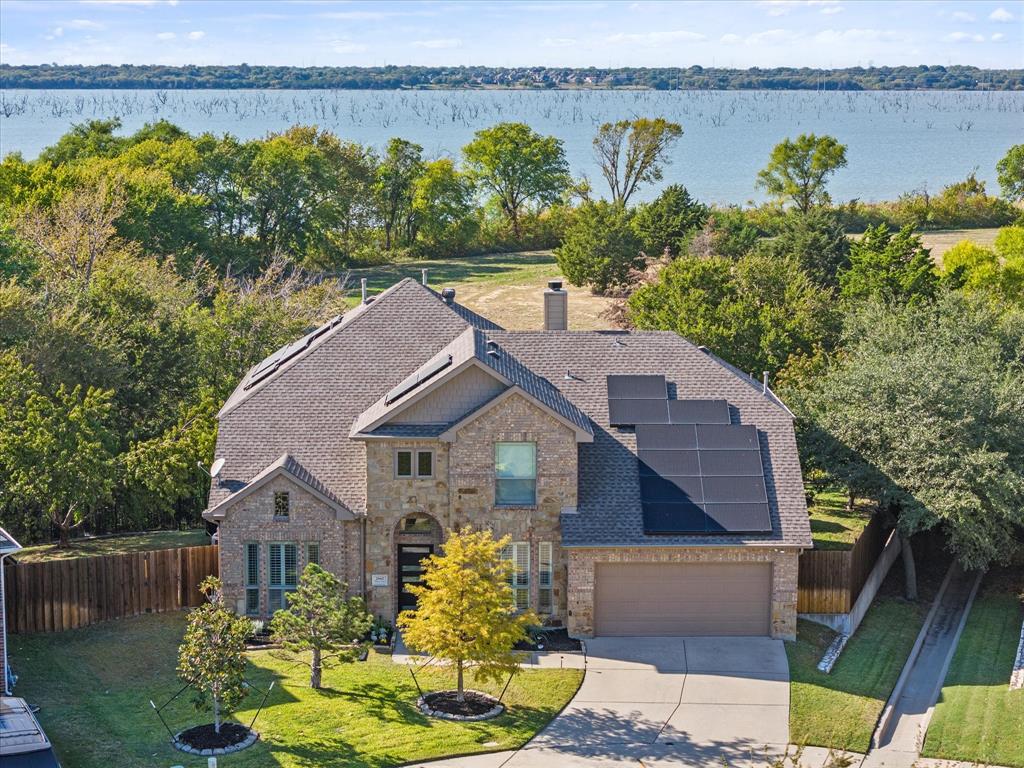 a aerial view of a house with a lake view