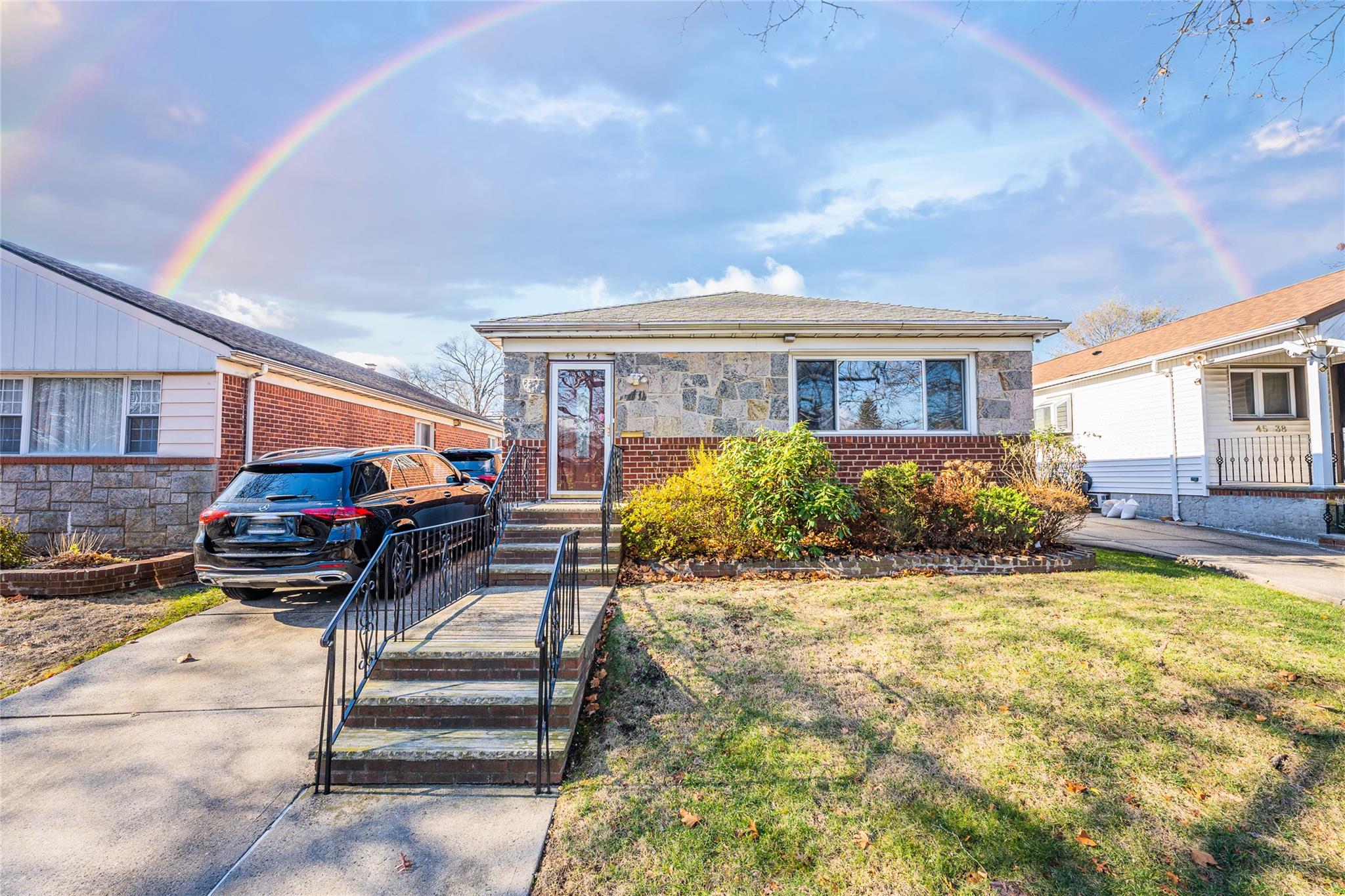 Bungalow with a front lawn