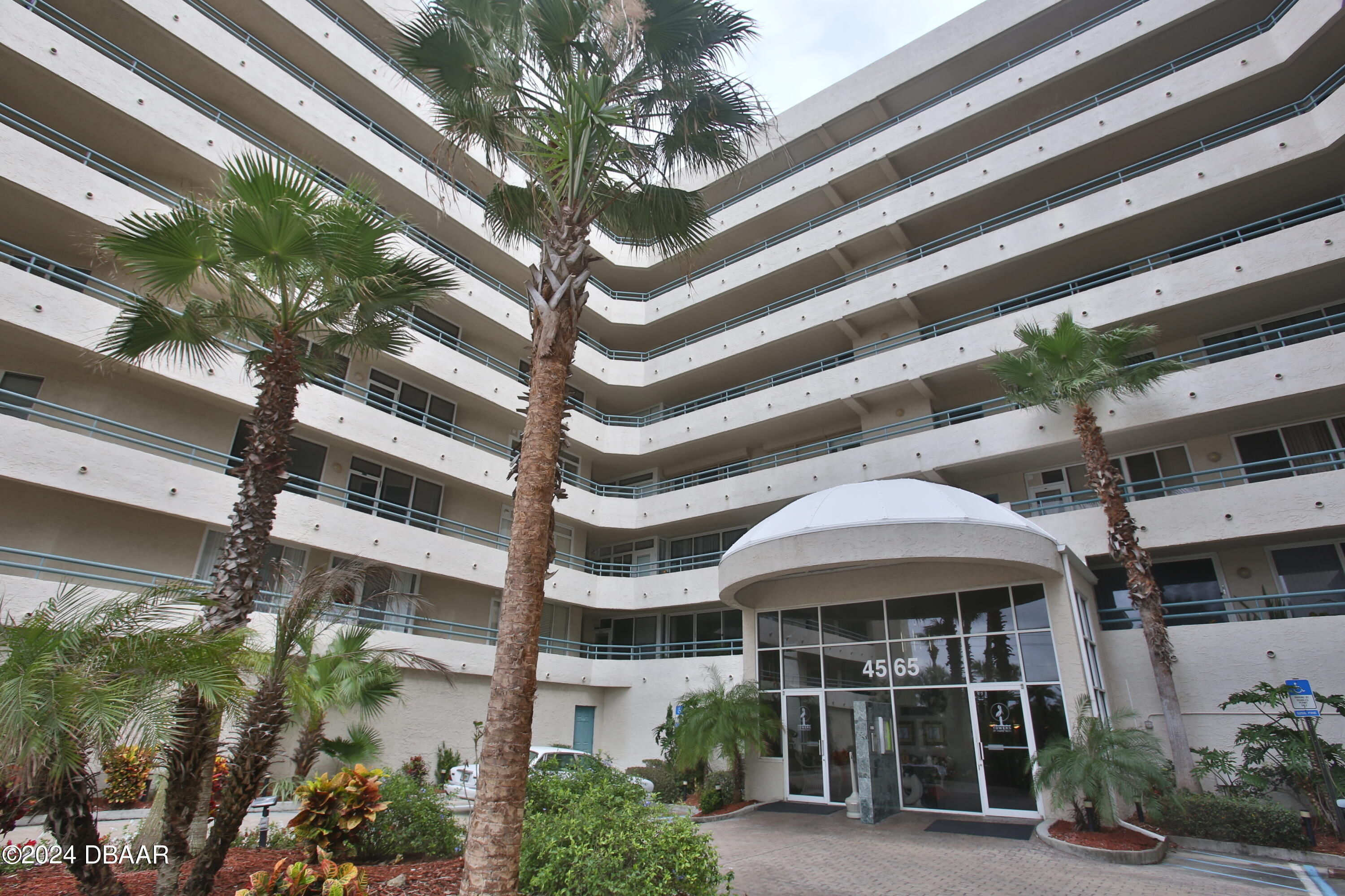 a front view of a building with balcony