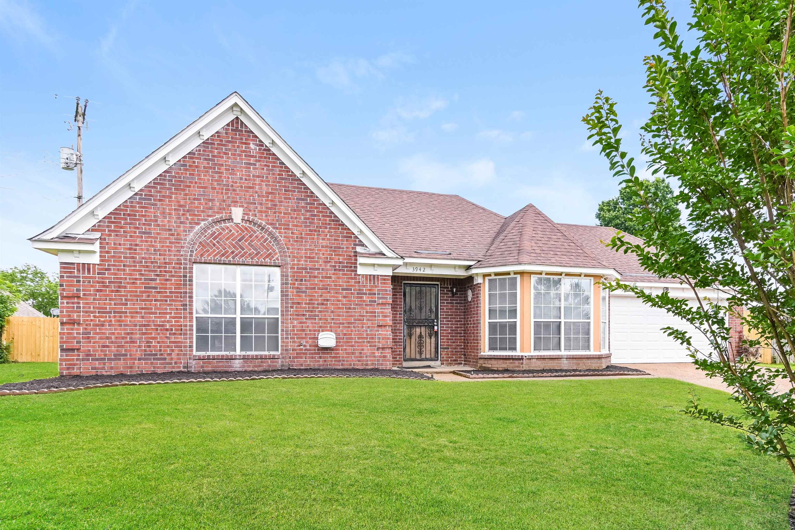 View of front of property with a front yard