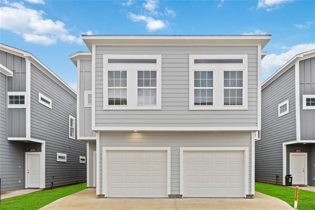 a front view of a house with a garage