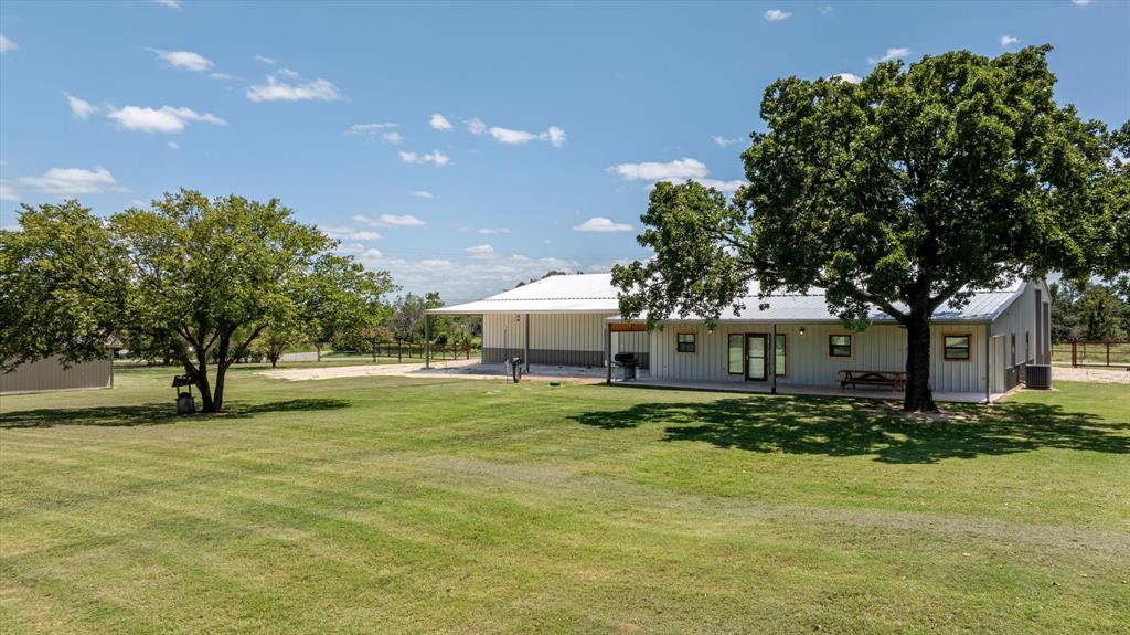 a view of a house with a back yard