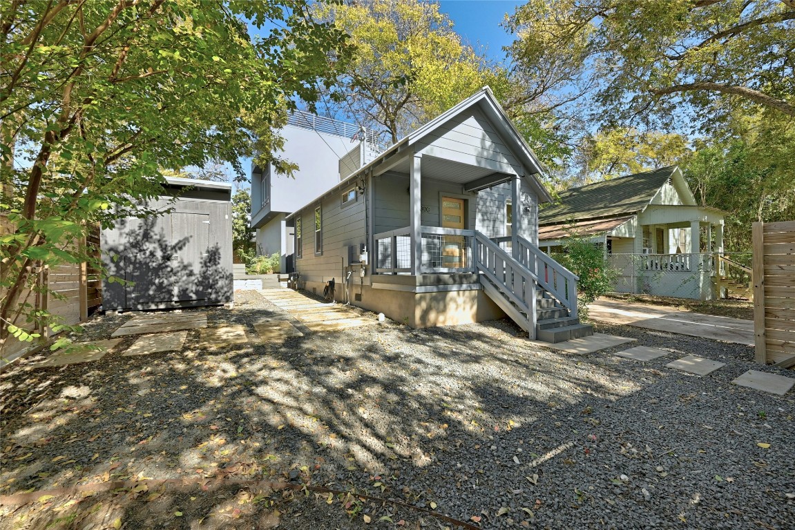 Corner View of entry, driveway, and sauna shed