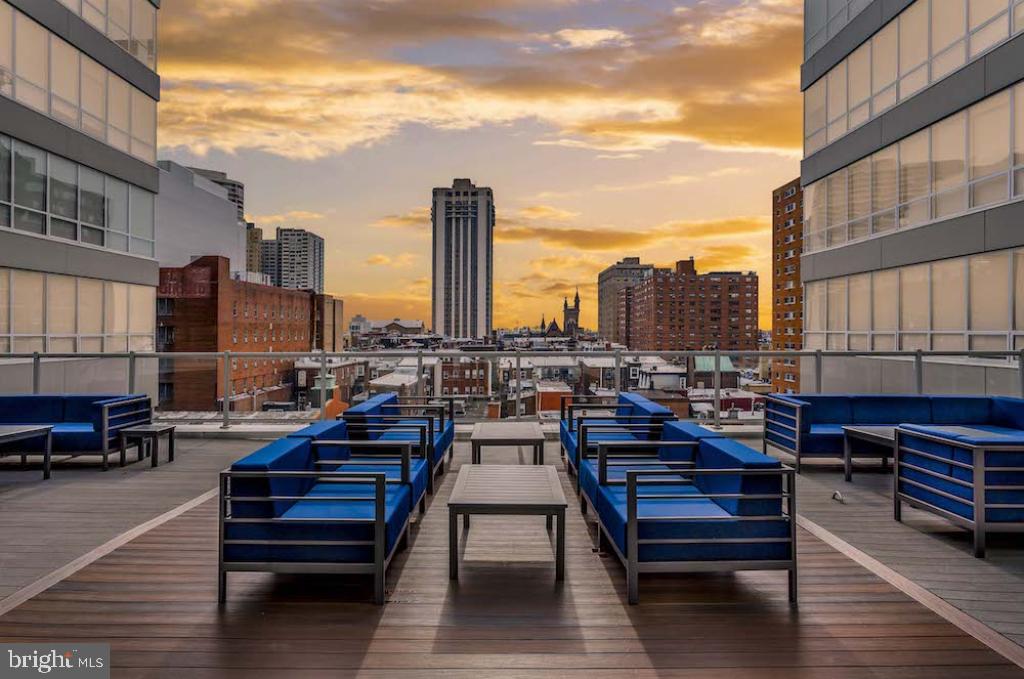 a view of a terrace with seating area and furniture