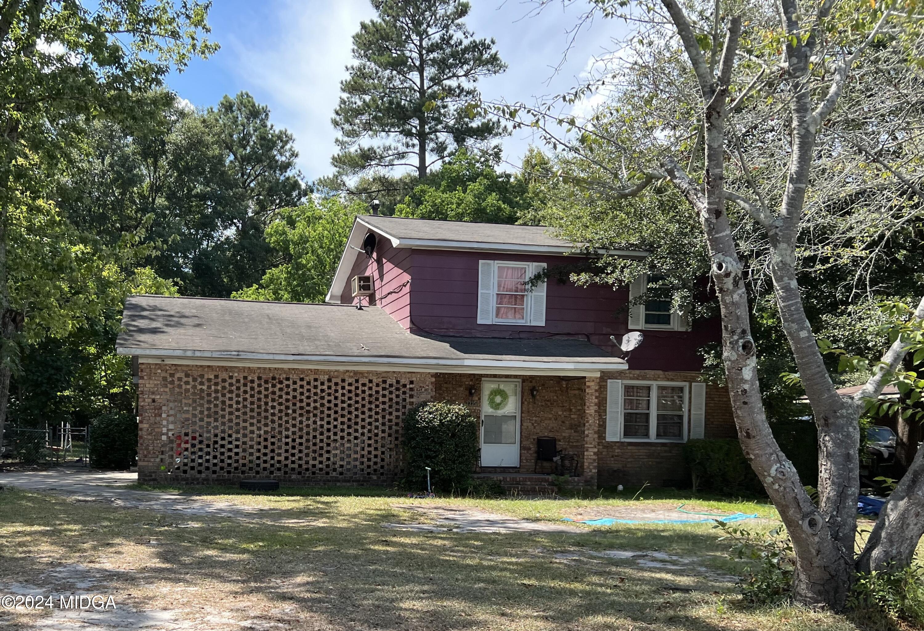 a view of a house with a yard