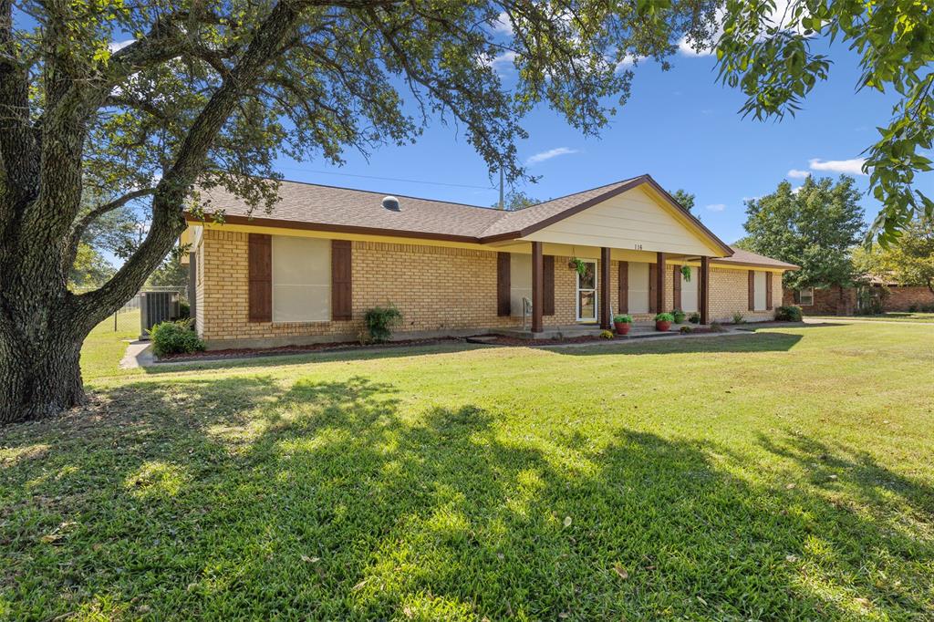 a front view of a house with yard