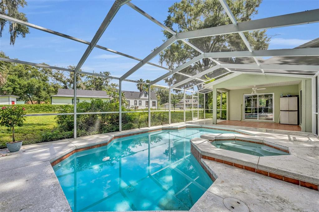 a view of a backyard with a swimming pool