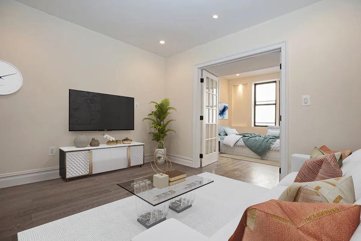 a living room with furniture and a flat screen tv