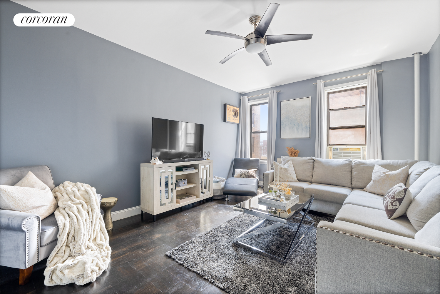 a living room with furniture and a flat screen tv