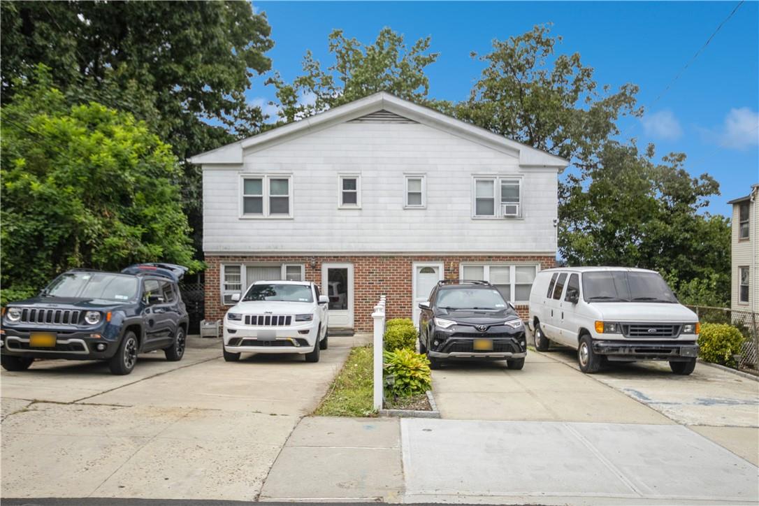 a view of car parked in front of house