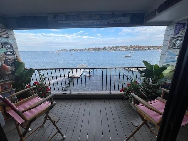 a view of a balcony with chairs