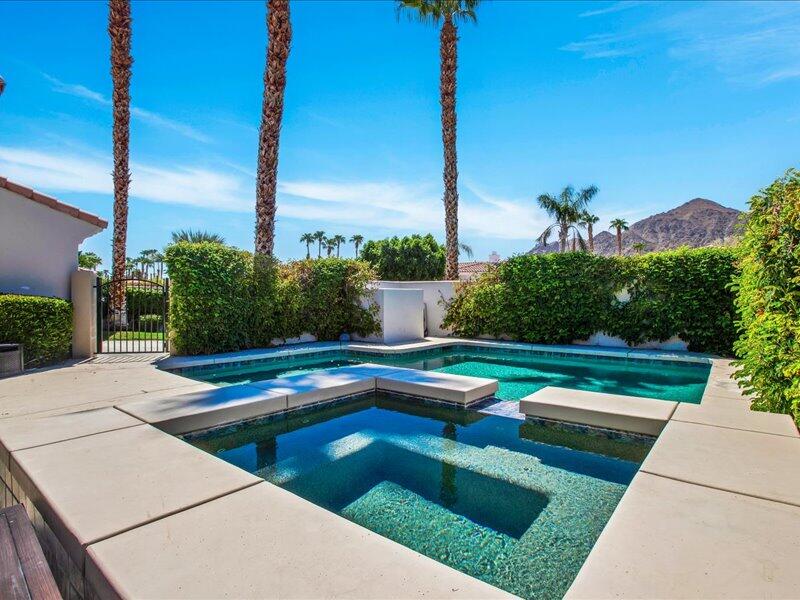 a view of a patio with swimming pool