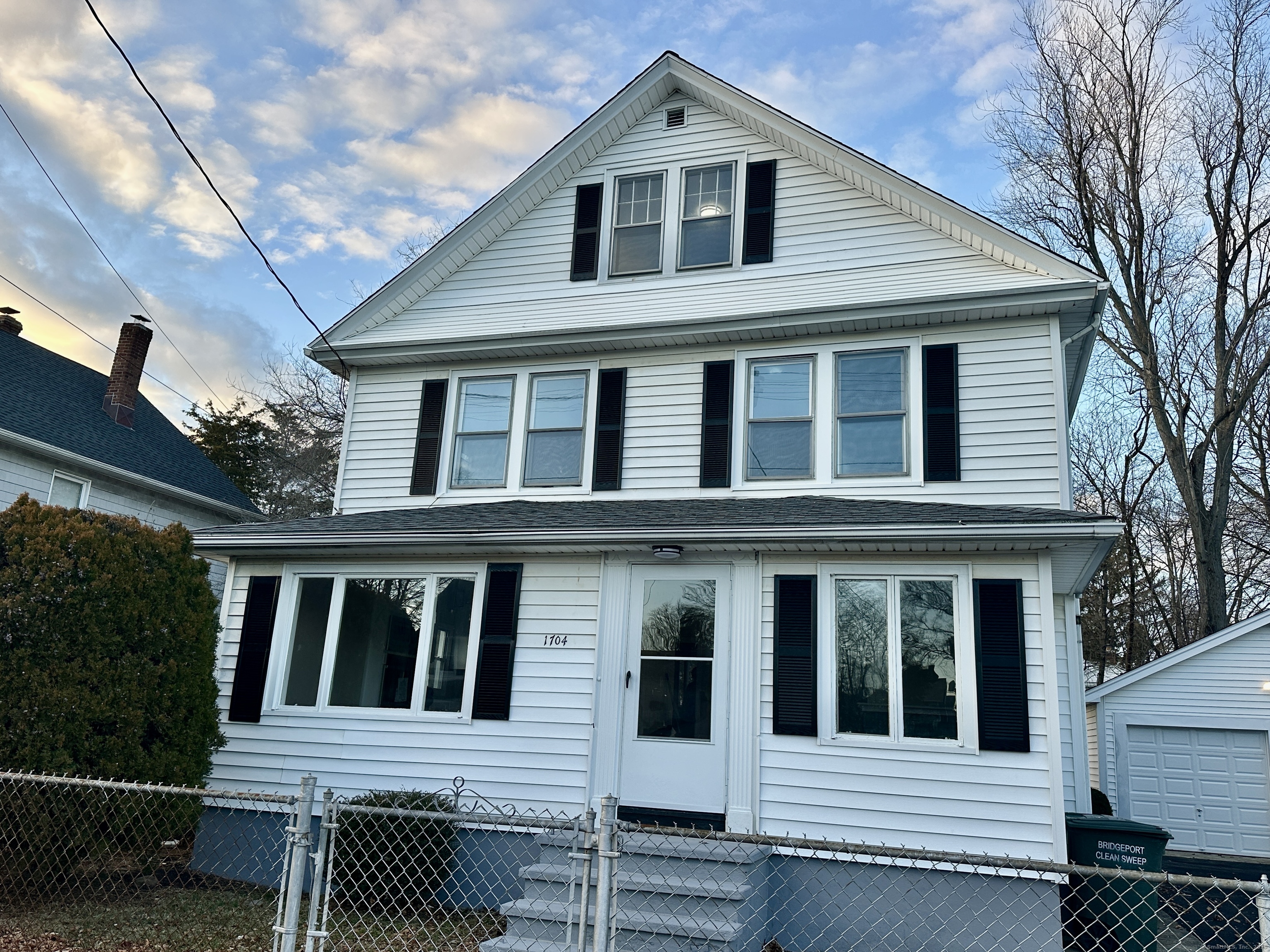 a front view of a house with a porch