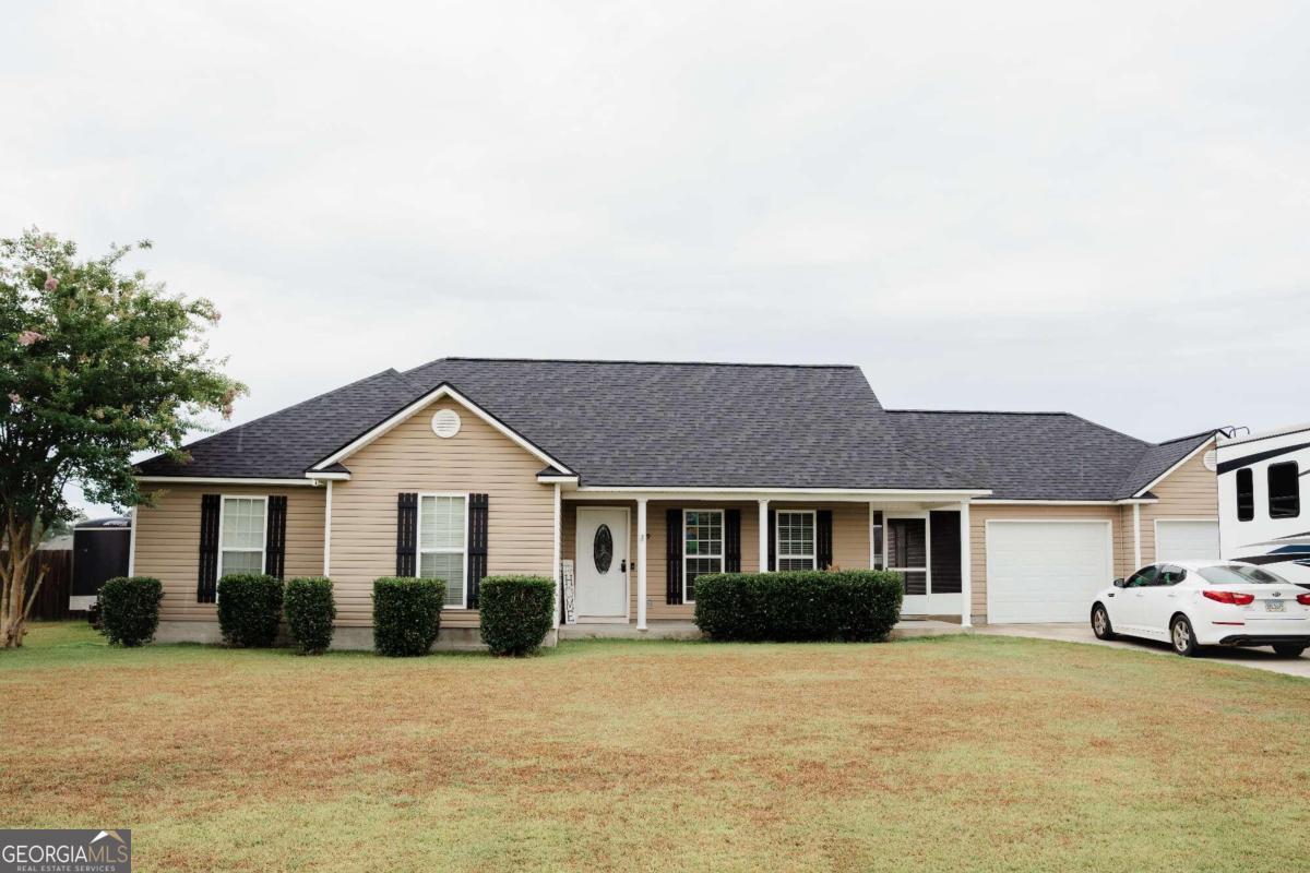 a front view of a house with a yard