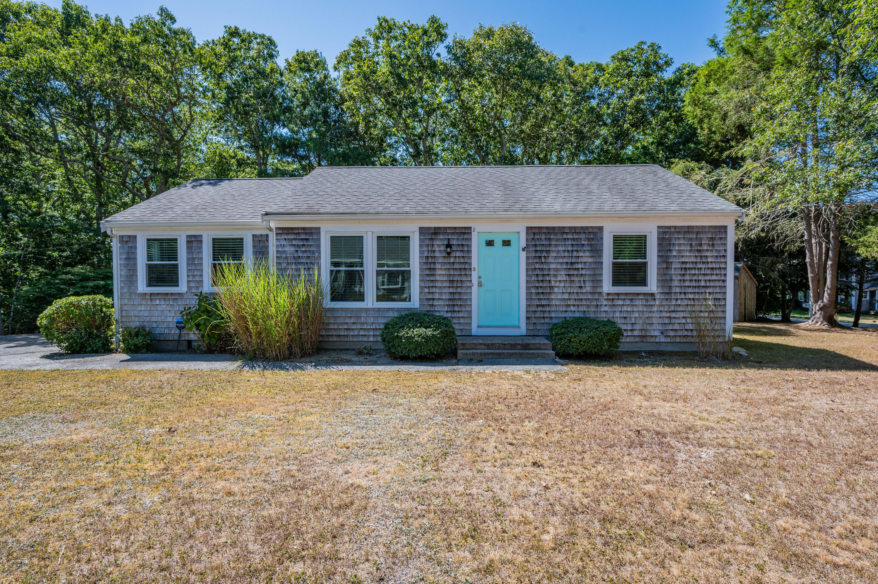 front view of a house with a yard