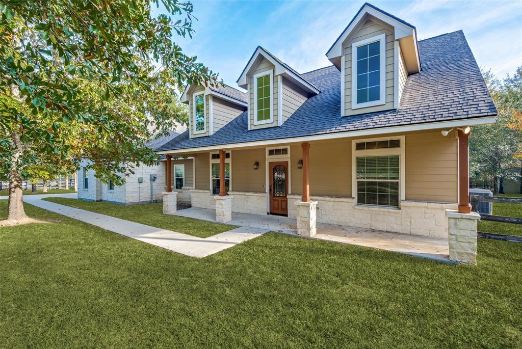 front view of a house with a yard