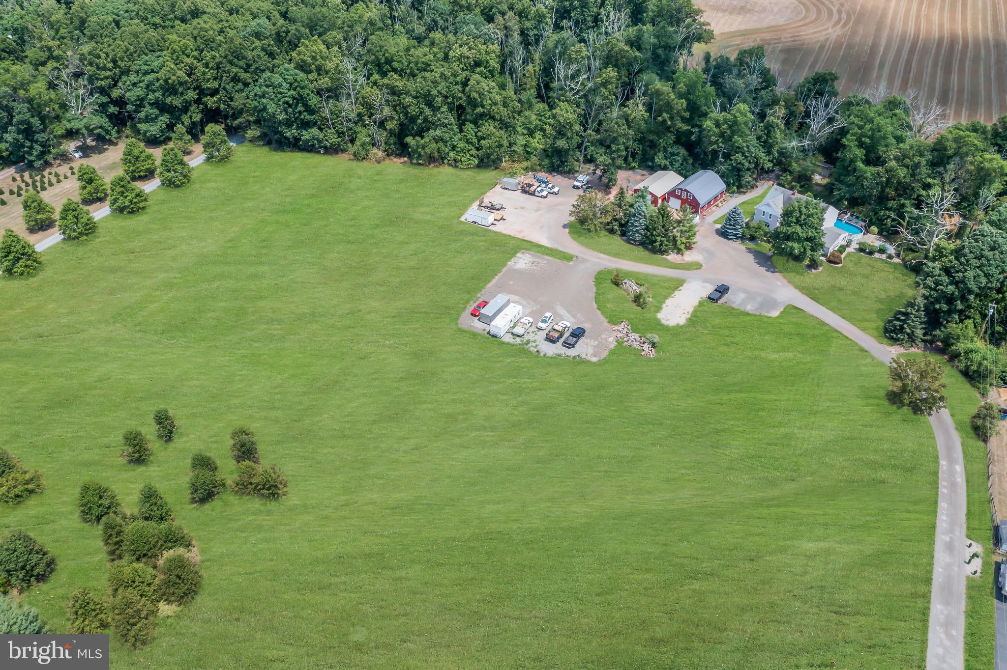 a backyard of a house with lots of green space