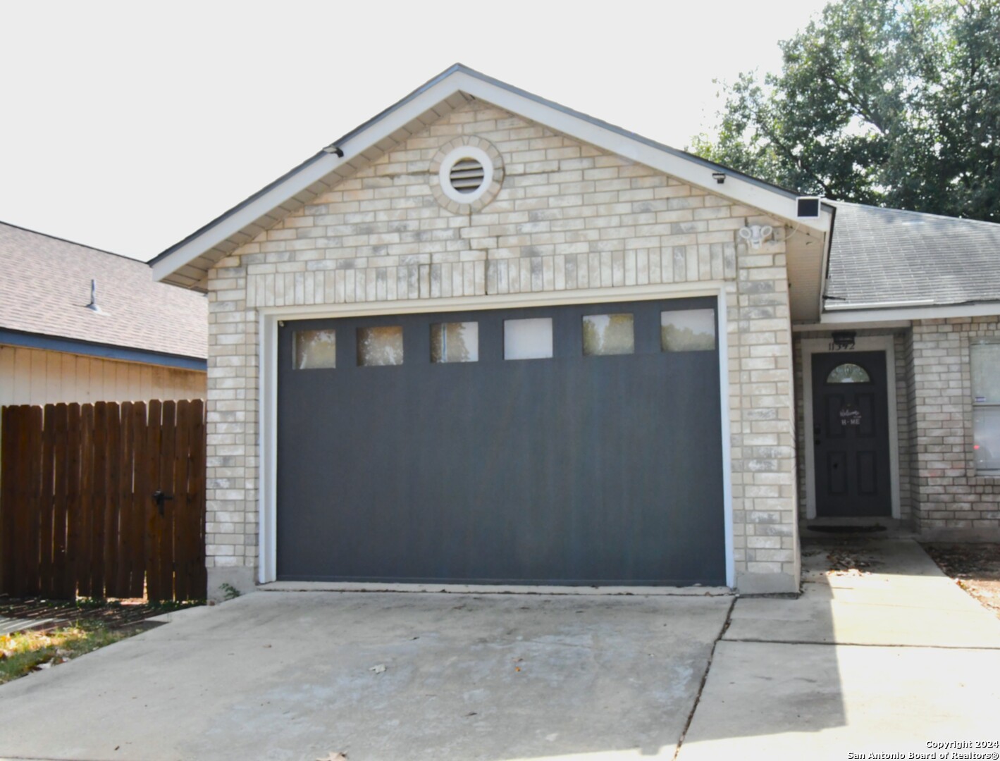 a front view of a house with a garage