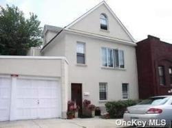 a front view of a house with a garage