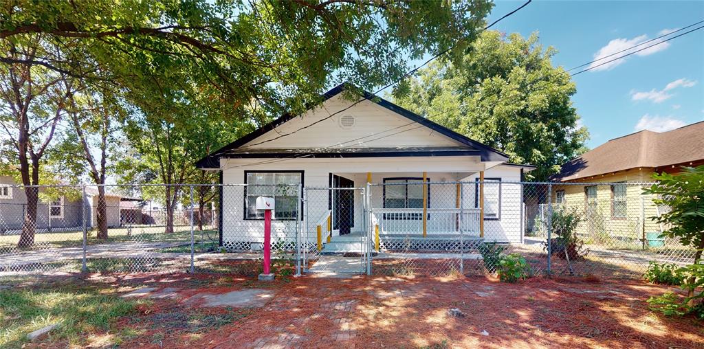 a front view of a house with small yard