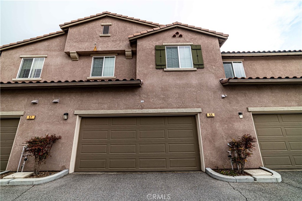 a front view of a house with a garage