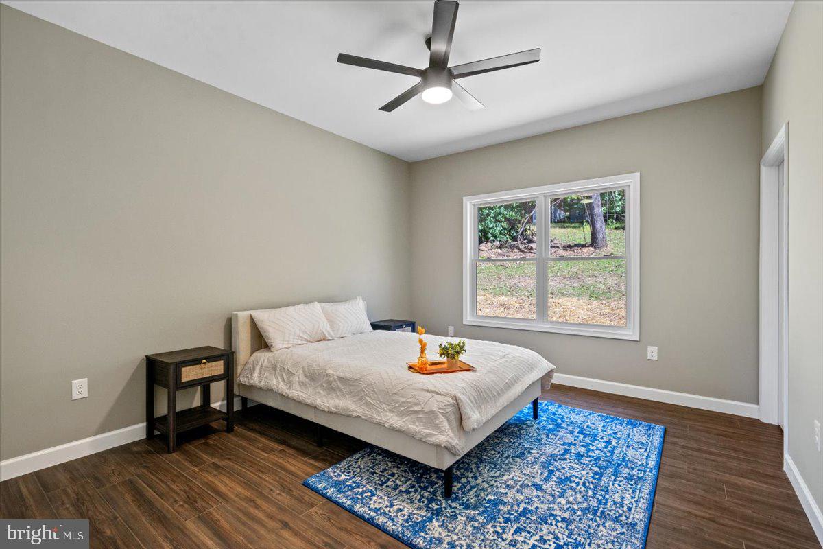 a bed room with furniture and a window