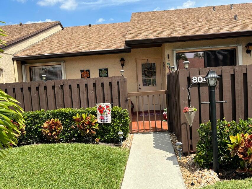 a front view of a house having yard