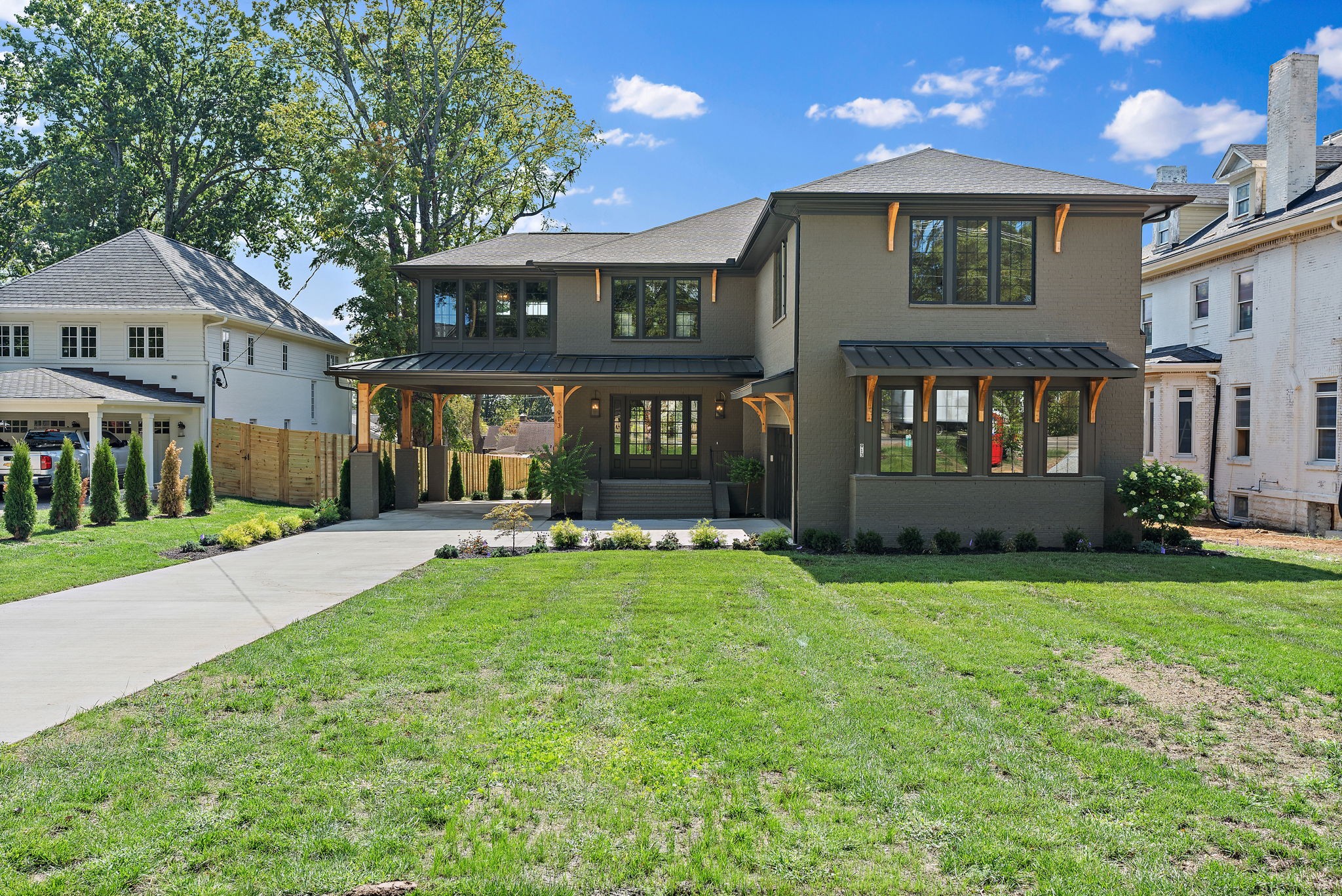 a view of house with a yard