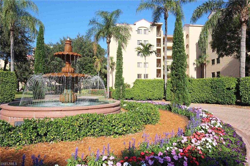 a view of a fountain in front of a house