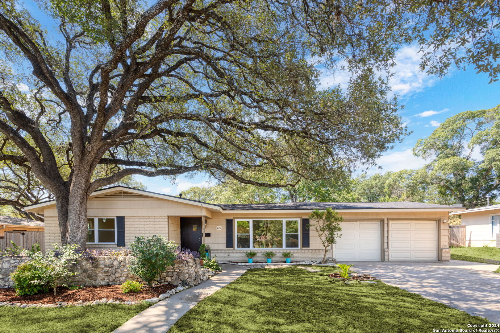 front view of a house with a yard