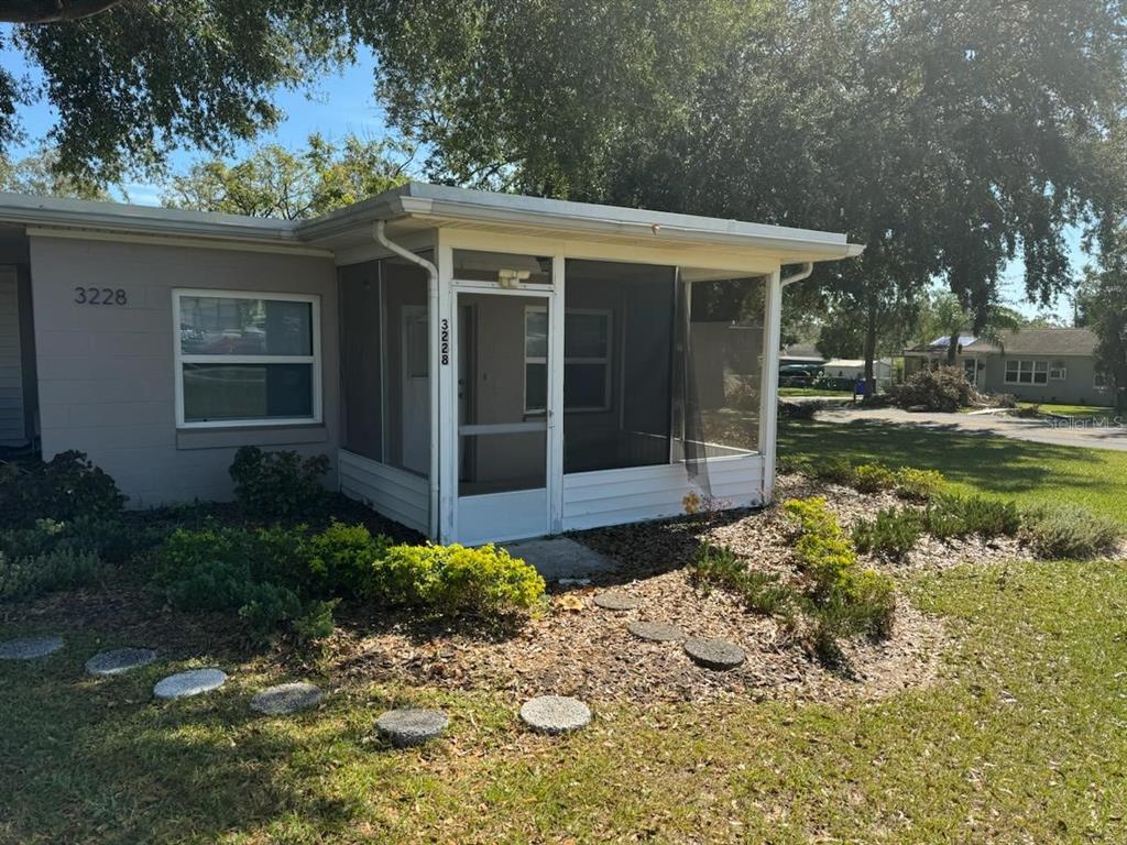 a view of a house with a yard