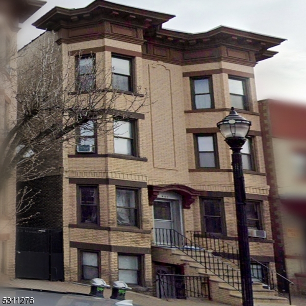 a front view of a building with many windows